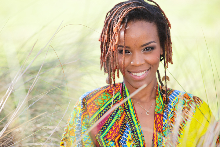 Smiling African American Woman With Short Dreads Hairstyle