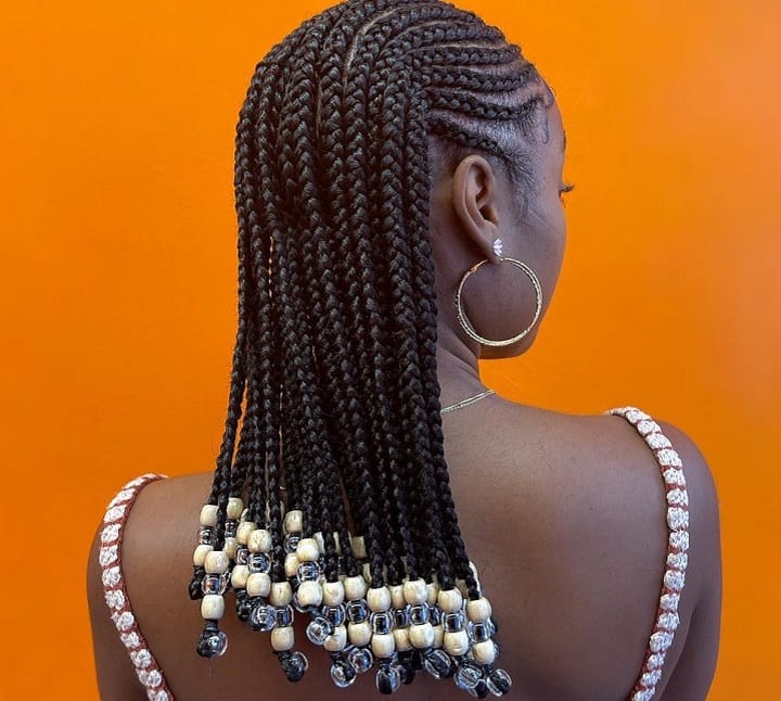 African American Woman With Layered Beaded Braids