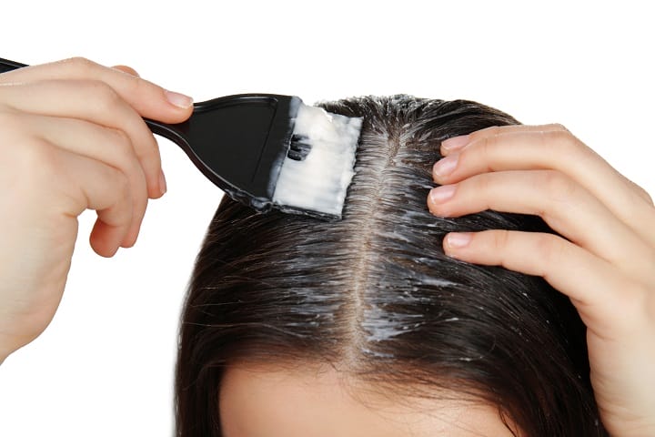 Applying a Coconut Oil For Hair With a Brush