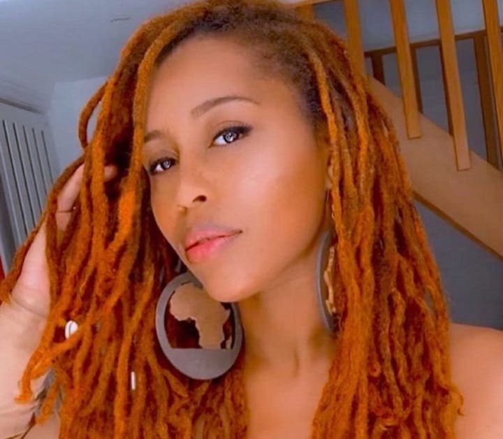 African American Woman With Ginger Dreadlocks