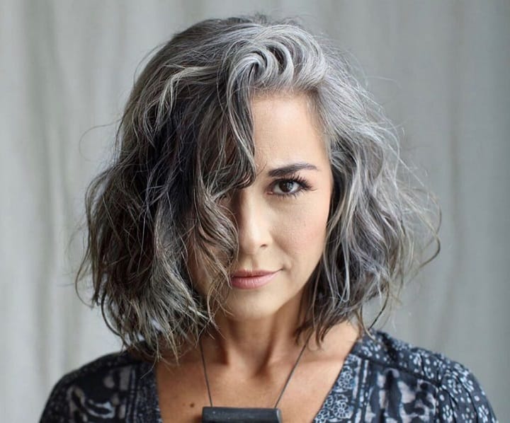 Women With a Dark Hair With Grey Highlights