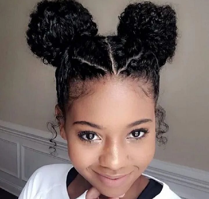 Smiling Young Woman With Puffball Buns Hairstyle