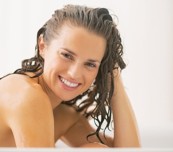 Smiling Woman Washing Her Hair
