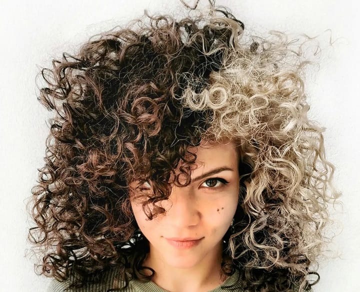 Girl With Skunk Blonde Stripes on Naturally Curly Hair