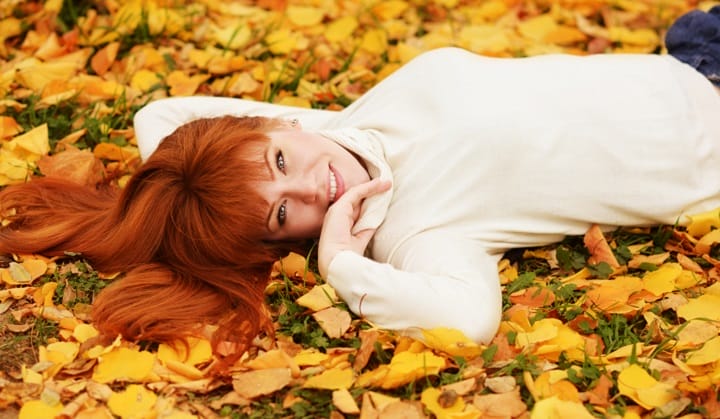 Smiling Woman With a Pumpkin Hair Color