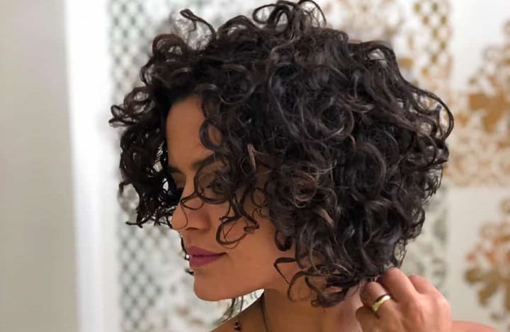 Woman Wit Perm Bob With Tousled Curls Hairstyle 