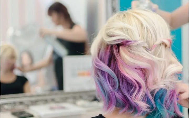 Woman With Platinum Layer Over the Rainbow Hairstyle