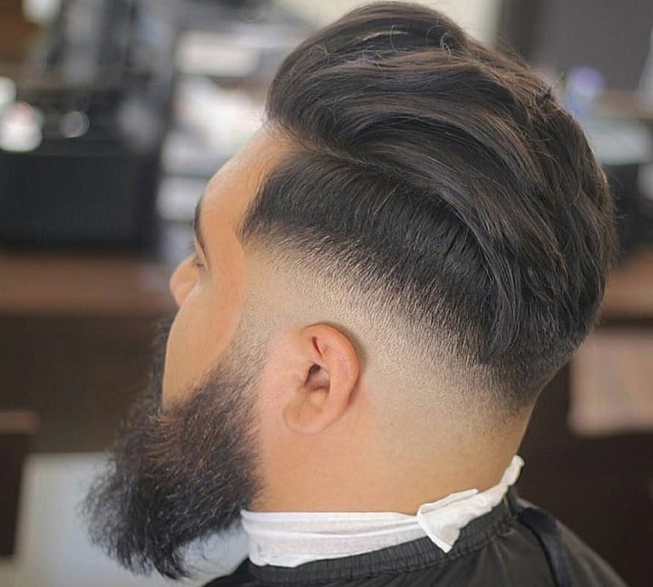 High Bald Fade With Line Up and Wavy Brush Back 