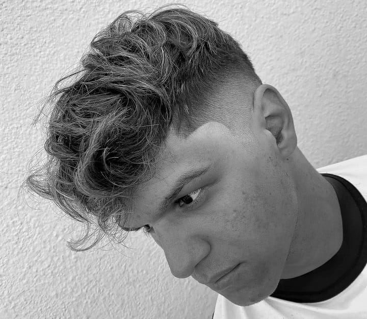 High Razor Fade With Textured Messy Hair 
