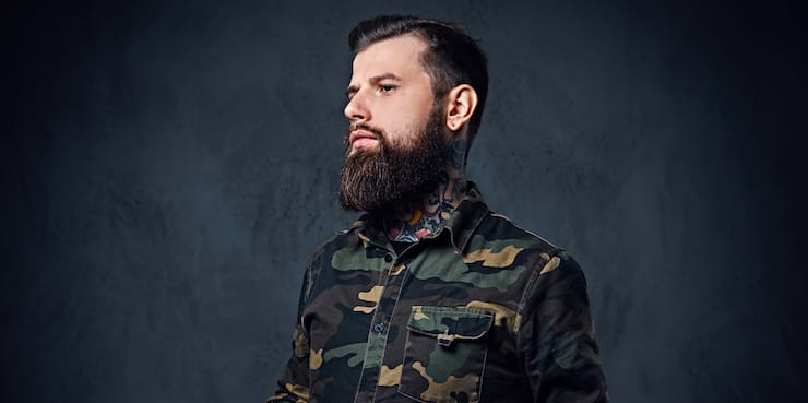 tattooed bearded guy with military haircut