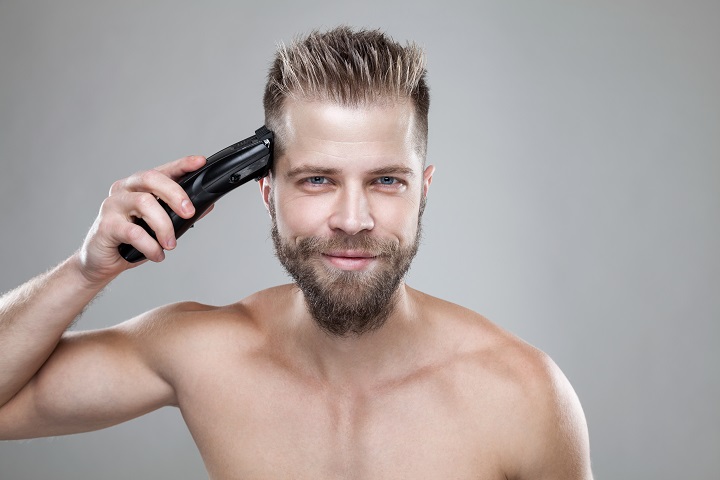 Man Cutting His Hair With a Clipper