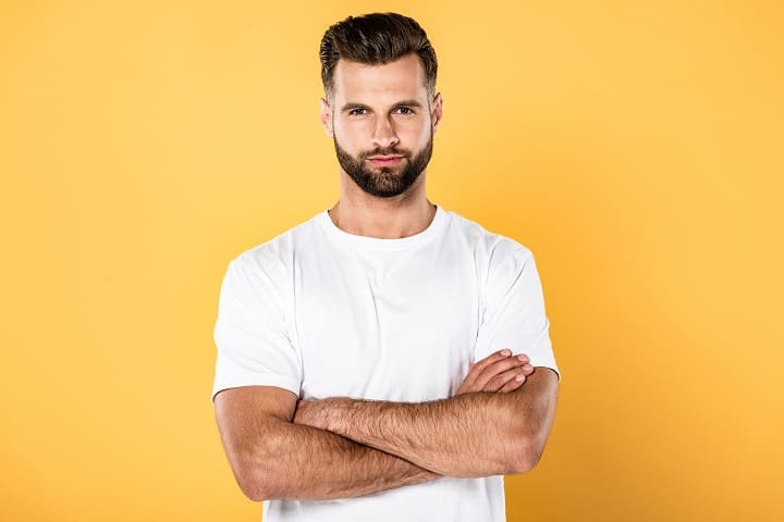 Man in White T-shirt With Crossed Arms