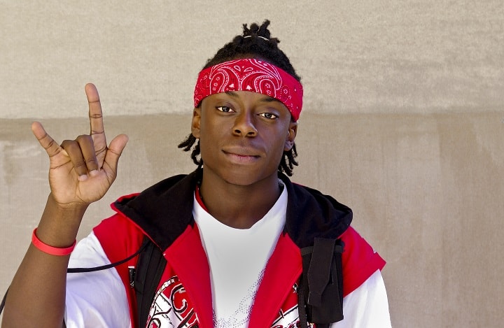 Black Man With a Bandana Making the Rock n Roll Hand Sign