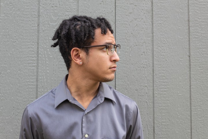 Man With Glasses and Twist Medium Hairstyle