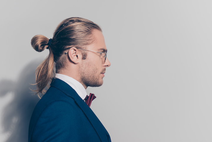 Businessman With Glasses and a Subtle Rat Tail Hair