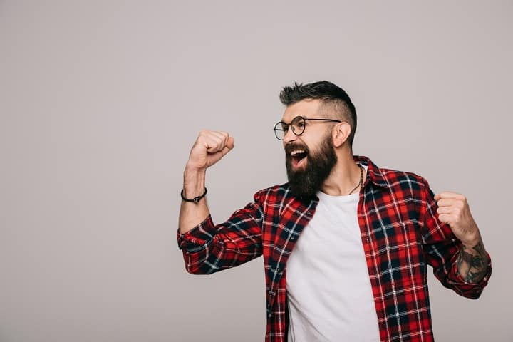 Excited Bearded Man in Checkered Shirt