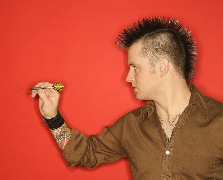 Young Man With Spiky Punk Hair Playing Picado