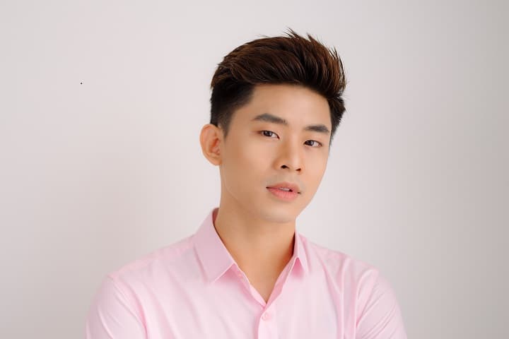 Korean Man Is Standing and Posing on Gray Background