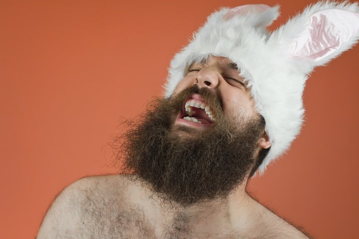 Laughing Bearded Man Wears Bunny Ears