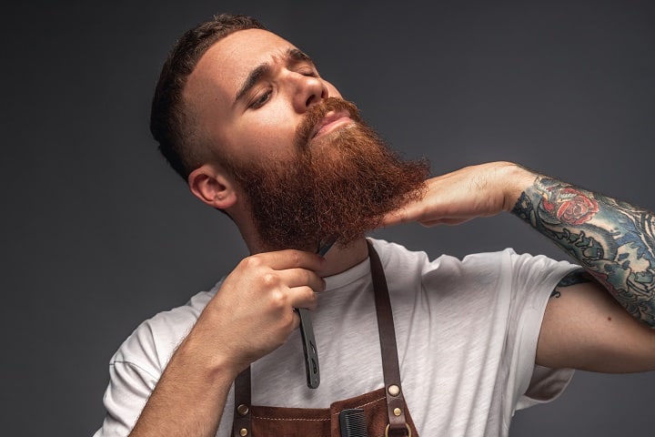 Man Is Measuring His Beard