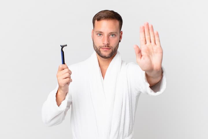 Man Showing Open Palm Making Stop Gesture
