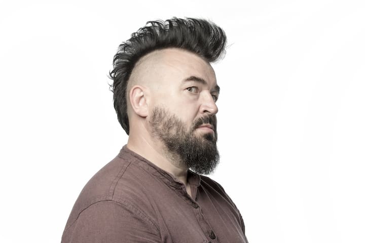 Older Punker With Mohawk Hairstyle and a Beard
