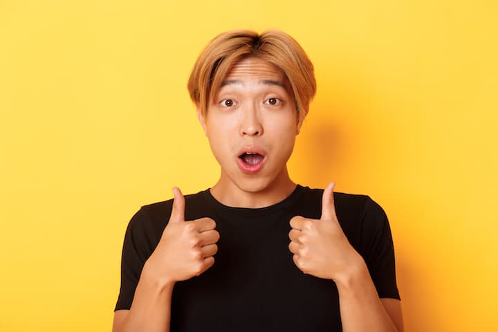 Orange Haired Korean Man With Perm Hairstyle Showing Thumbs Up