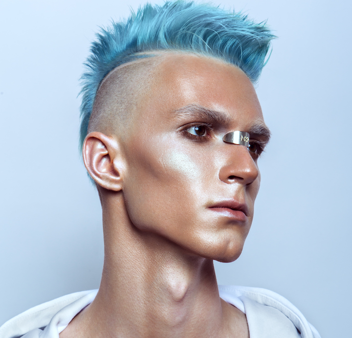 Young Man Wearing Spiky Blue Mohawk Hairstyle